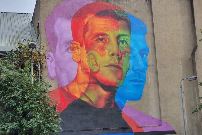 Belfast Troubles Murals Street Art and Peace Wall Walking Tour - Divis Street International Mural Wall: the causes go global