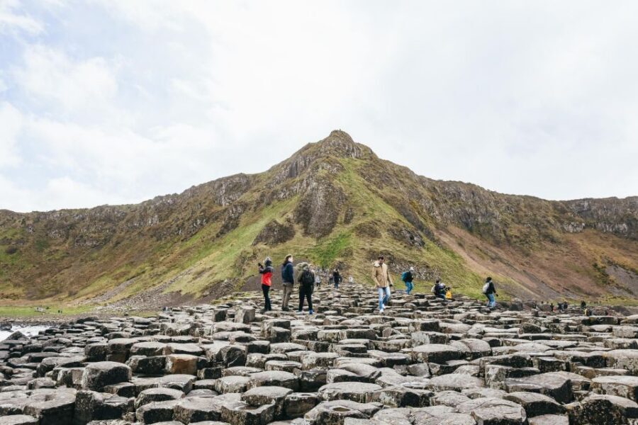 From Belfast: Giant's Causeway Full-Day Guided Trip - Carrickfergus Castle: a quick photo stop with big coastal mood