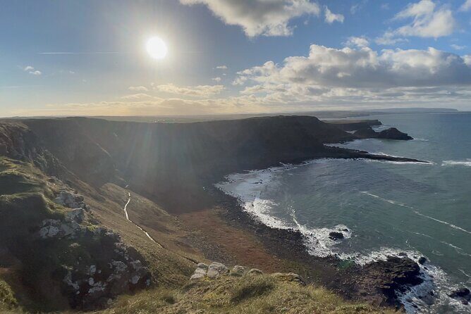 Giants Causeway Tour from Belfast + FREE Belfast Mural Tour - Dunluce Castle ruins: history in the wind