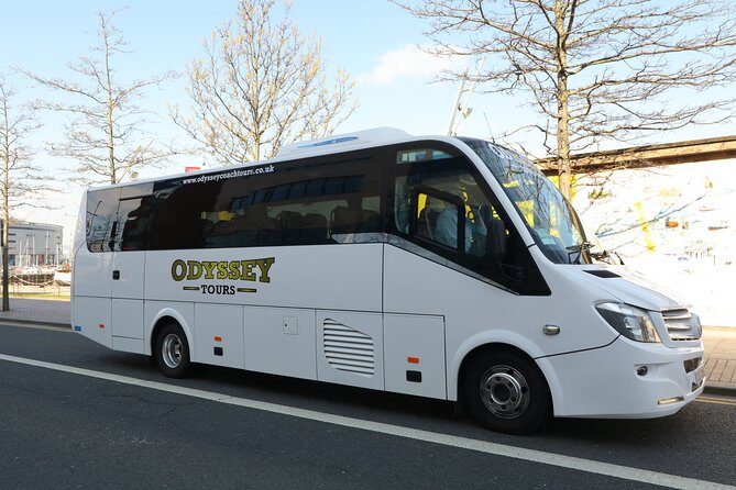 Guided Day Tour of Giant's Causeway from Belfast by Comfortable Coach - Dunluce Castle photo stop: short time, big cliff energy