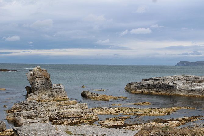 Small Group Giant's Causeway Day Tour from Belfast - Dunluce Castle photo stop: quick story, limited time